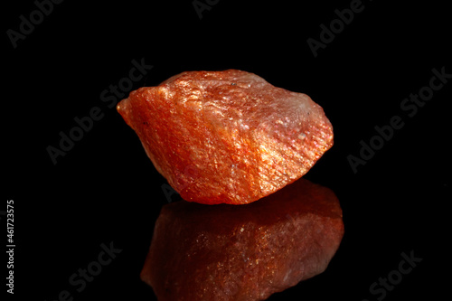 Macro mineral stone Nepheline sunny stone black background photo