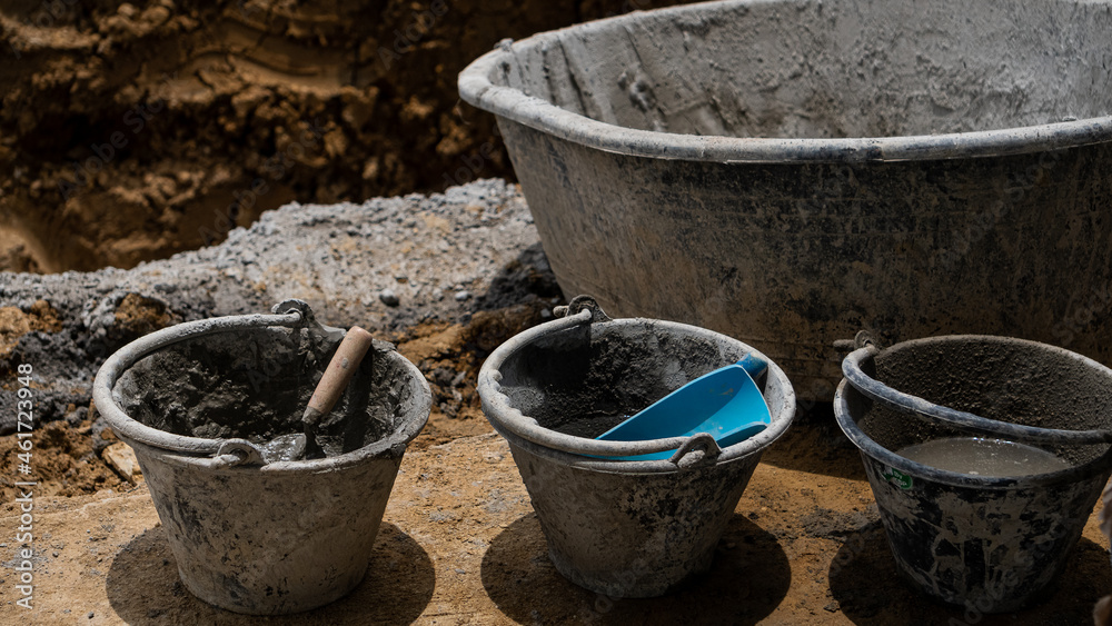 4 cement buckets on the floor for a construction industry business idea. 4 cement buckets on the floor for a construction industry business idea.