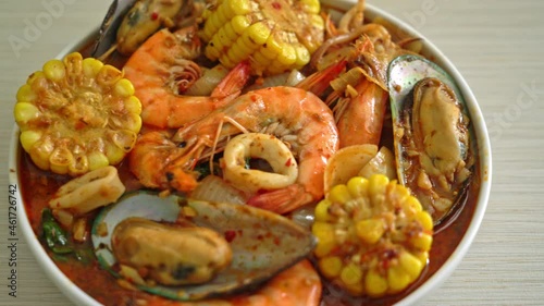 spicy barbecue seafood - shrimps, sqiud, mussel and corn photo