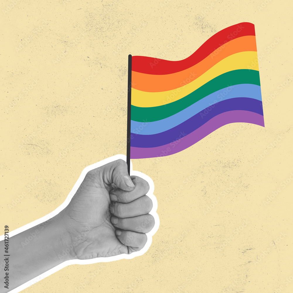 Hand holding rainbow LGBT flag against light background, artwork ...