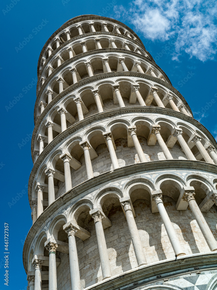 Tower of Pisa in Italy seen from below, with blue sky