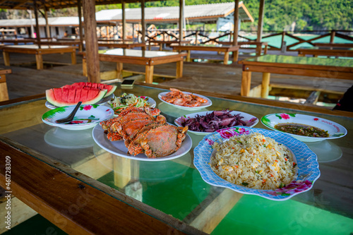 Seafood on glass table over sea , Thailand