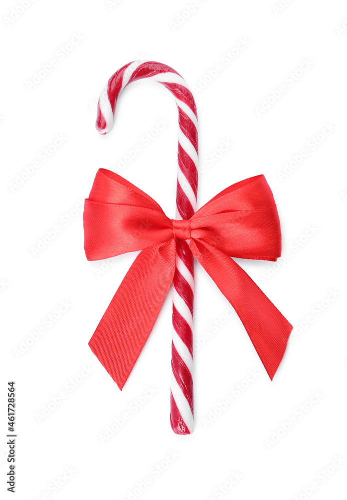 Sweet Christmas candy cane with red bow on white background, top view Sweet Christmas candy cane with red bow on white background, top view