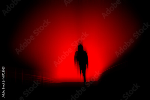 A dark, horror concept. Of a blurred hooded figure silhouetted against lights at night. With a black, red moody edit.