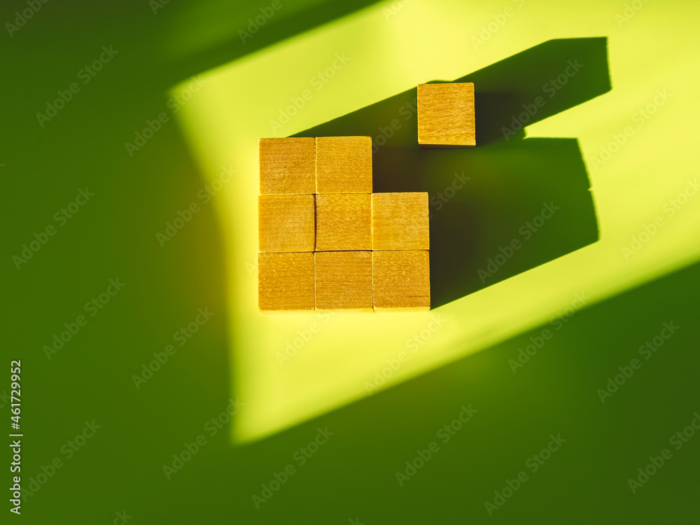 9 Block Sign Nine wooden blocks in the form of the square on the green background ...