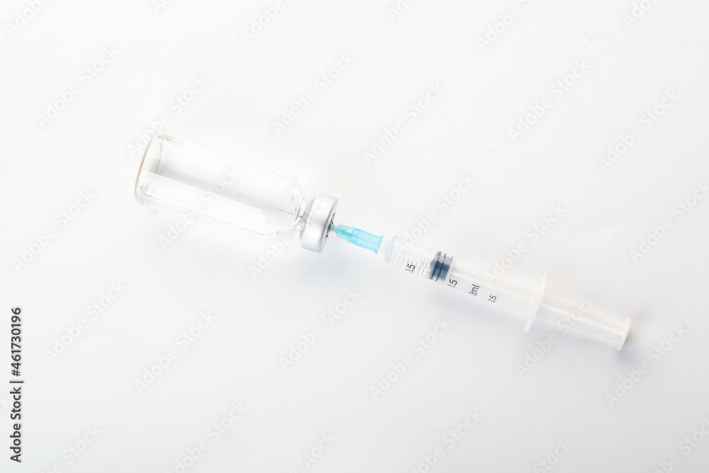 Syringes and glass bottles in white background Syringes and glass bottles in white background