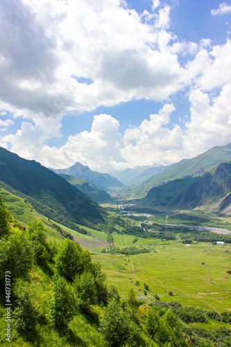 Mountain landscape. View of the mountains, mountain valleys and clouds above them. © Юлия Ненадовец