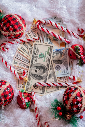 Money paper dollars on a white background with Christmas props. New year and christmas and finance.