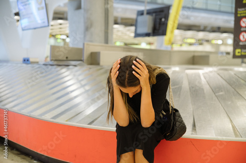 Fototapeta Naklejka Na Ścianę i Meble -  Frustrated woman lost baggage in airport