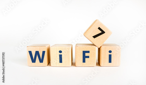 WiFi 7 symbol. The concept word WiFi 7 on wooden cubes. Beautiful white table  white background  copy space. Business  technology and WiFi 7 or WiFi7 concept.