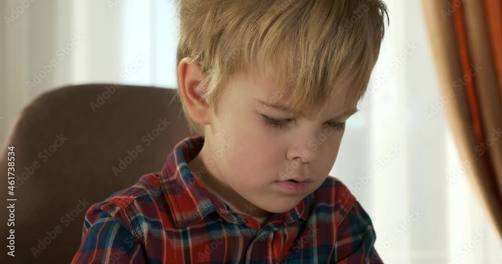 Cute Little Child Kid Study Distance Learning at Home. Preschooler Boy Sits at Desk Table in Room Near Window 4K Cute Little Child Kid Study Distance Learning at Home. Preschooler Boy Sits at Desk Table in Room Near Window 4K