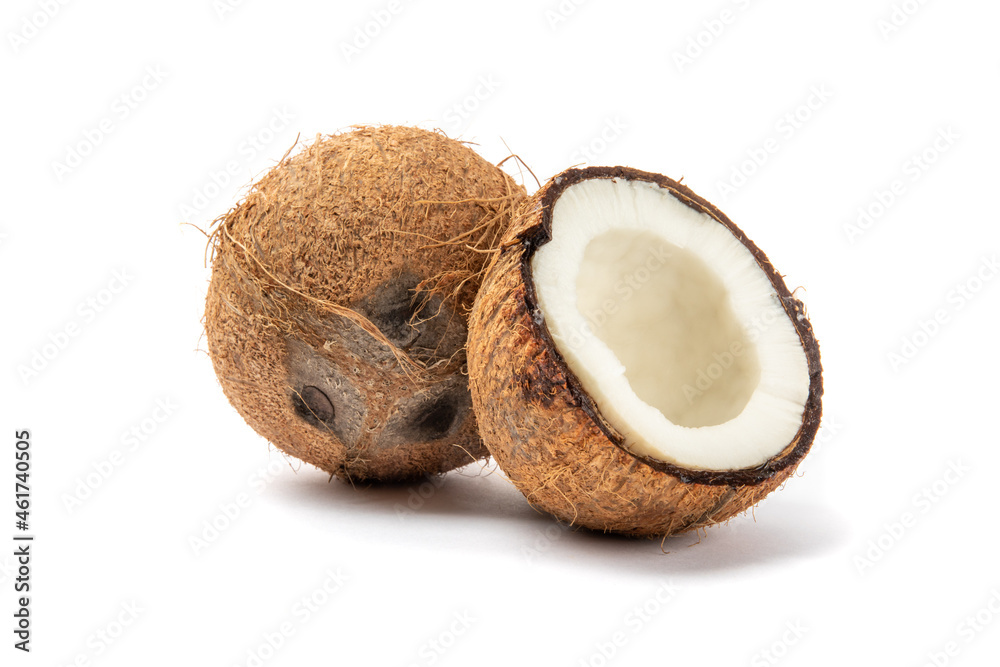 a ripe coconut with another broken in half to reveal the sweet flesh inside isolated on white
a ripe coconut with another broken in half to reveal the sweet flesh inside isolated on white