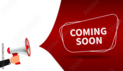 Male hand holding megaphone with Coming soon speech bubble. Loudspeaker. Banner for business, marketing and advertising. Vector illustration.