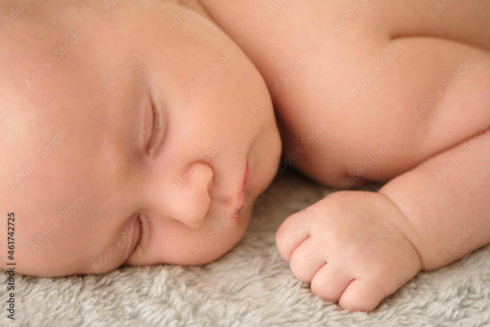 Closeup portrait of a cute infant baby sleeping. Beautiful white small baby sleeping at home. Portrait of a tiny caucasian boy resting. Face of a napping child, during an afternoon nap. Kid relaxing. Closeup portrait of a cute infant baby sleeping. Beautiful white small baby sleeping at home. Portrait of a tiny caucasian boy resting. Face of a napping child, during an afternoon nap. Kid relaxing.