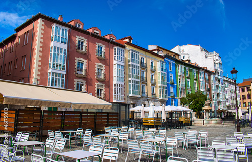 Terraza y hermosas arquitectura con casas pintadas de colores en la plaza Huerto del Rey en Burgos, España photo