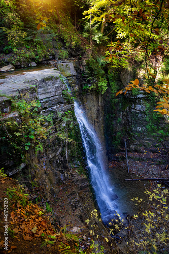 Beautiful waterfall among the canyon in the Carpathian mountains. Manyavsky waterfall. photo