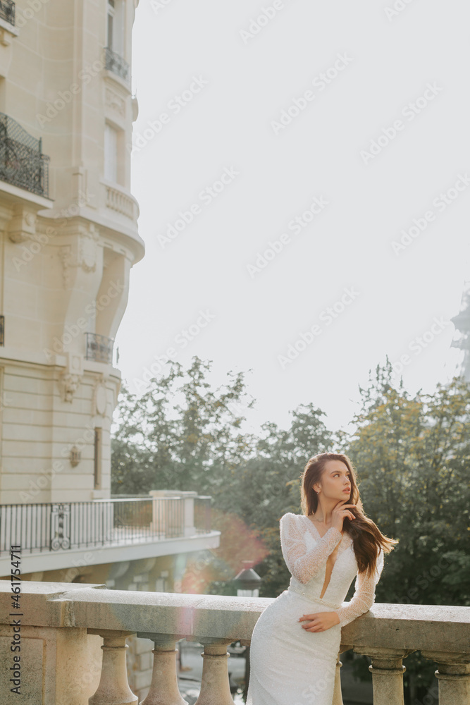 Photo of a beautiful brunette bride looking at the left side in France.