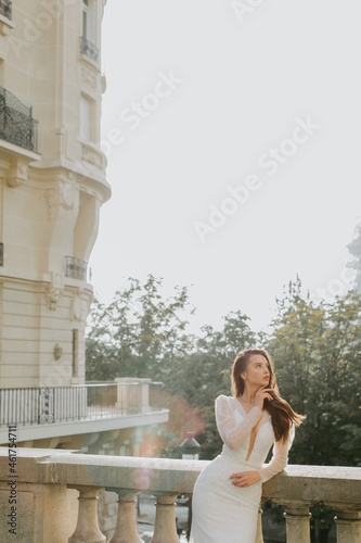 Photo of a beautiful brunette bride looking at the left side in France.