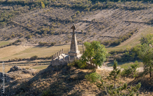 religious statue in the middle of large fields