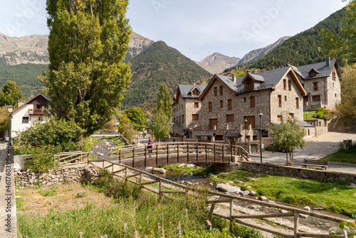 pretty village with wooden bridge and traditional houses