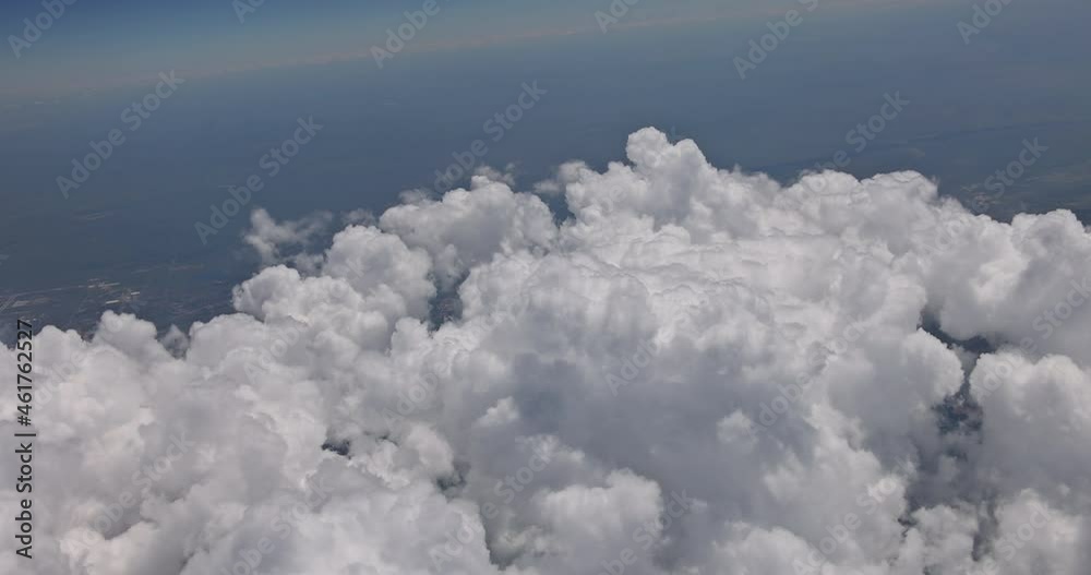 Clear blue sky under high clouds located top view of an airplane flying in the clouds. Clear blue sky under high clouds located top view of an airplane flying in the clouds.
