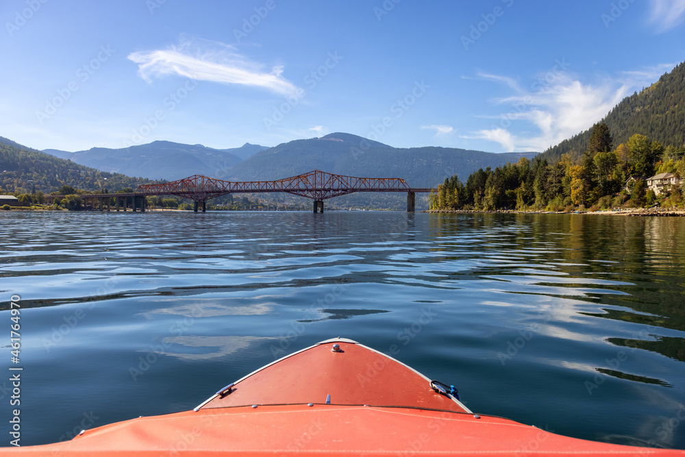 Boat riding on Kootenay River. Sunny Fall Season Morning. Located in Nelson, British Columbia, Canada.