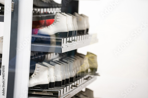 Closet with shelves full of ice skates for rent