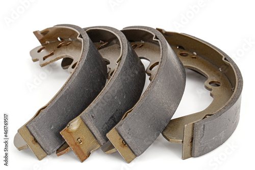 Set of asbestos brake pads, replacement spare parts of the car brake system, isolated on white background