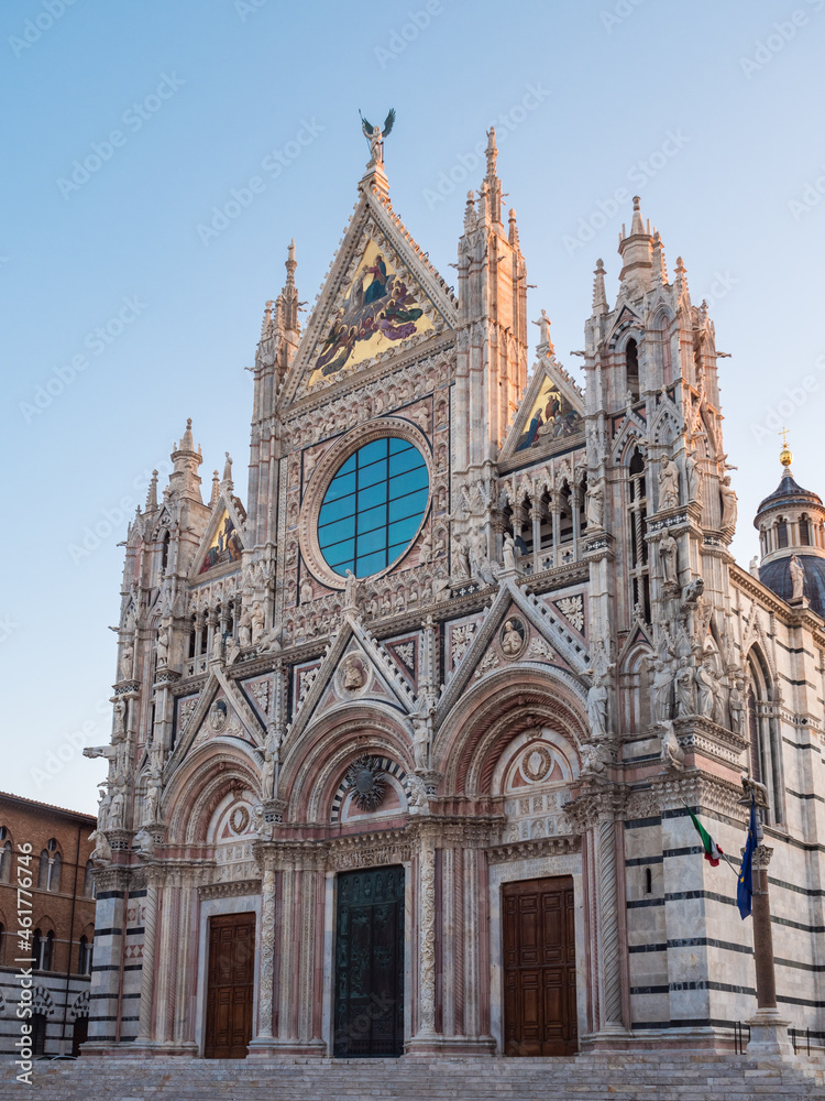 Siena Cathdral or Duomo di Siena West Facade Exterior in Italian Gothic Style in Tuscany, Italy