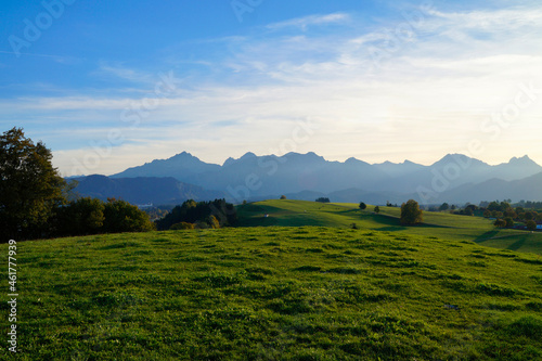 green meadows of the Allgau region in Bavaria with the Alps in the background (Hohenschwangau in Germany)   © Julia
