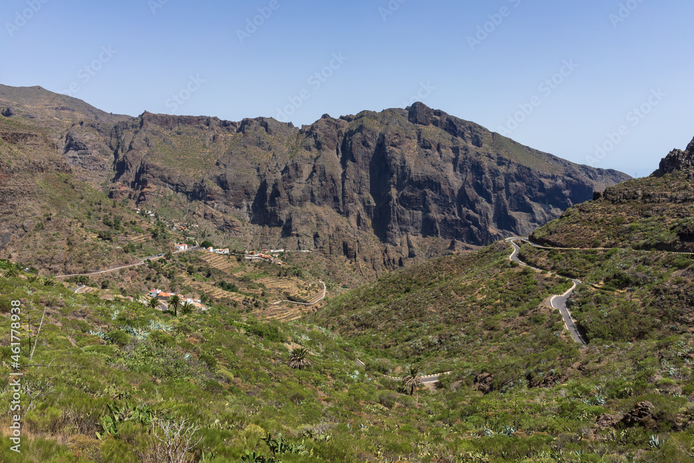 The Macizo de Teno mountains, Masca Gorge with mountain road to the village of Maska. View from the observation deck - Mirador La Cruz de Hilda. Tenerife. Canary Islands. Spain.