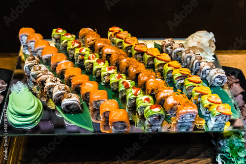Overhead japanese sushi food. Maki ands rolls with tuna, salmon, shrimp, crab and avocado. Top view of assorted sushi, all you can eat menu. Rainbow sushi roll, uramaki, hosomaki and nigiri.