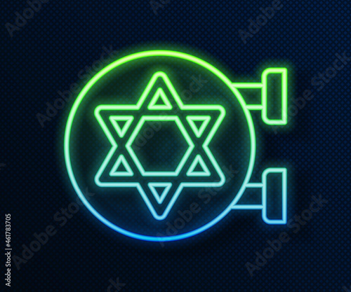 Glowing neon line Jewish synagogue building or jewish temple icon isolated on blue background. Hebrew or judaism construction with David star. Vector