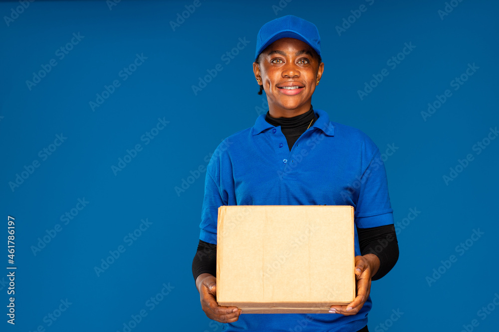 beautiful african delivery worker holding a parcel beautiful african delivery worker holding a parcel