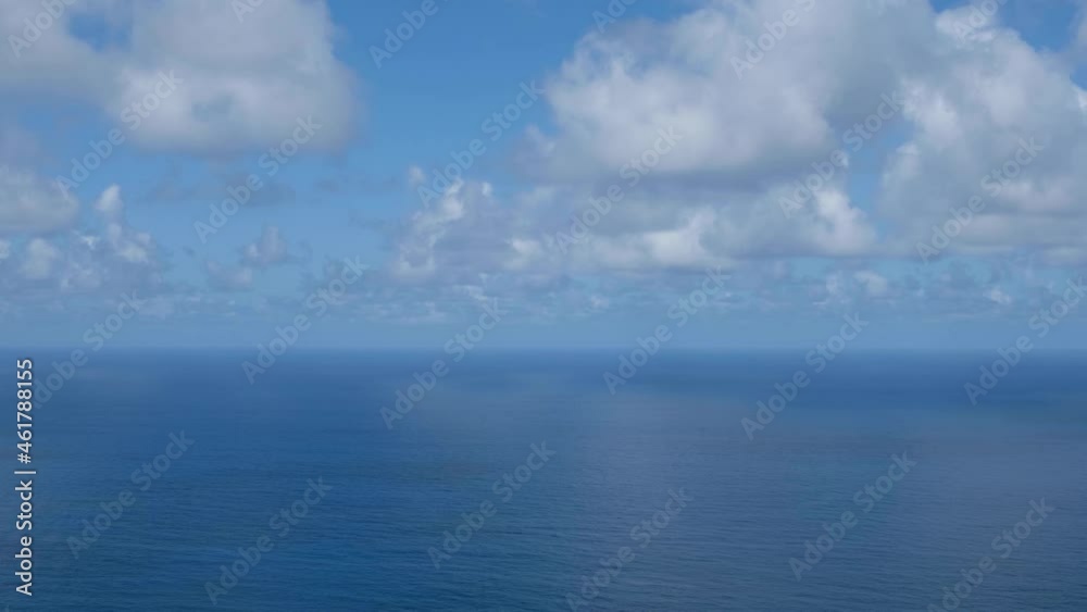 ocean horizon, open sea aerial with sunny blue sky and clouds ocean horizon, open sea aerial with sunny blue sky and clouds
