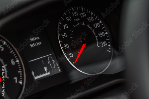 Close up view of a speedometer in a car. Kilometer counter. Car speedometer and dashboard.