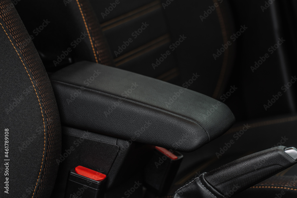 Car armrest opened. Opened armrest in the car for driver.