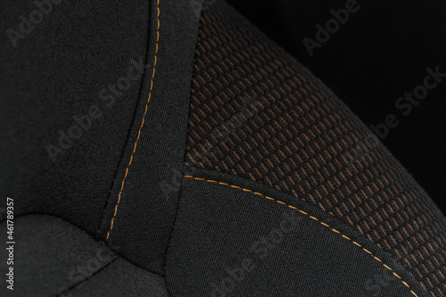 High angle view of modern car fabric seats. Close-up car seat texture and interior details. Detailed image of a car pleats stitch work.