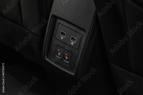 Seat heating in the car switched on. Car seat heating button. © Roman