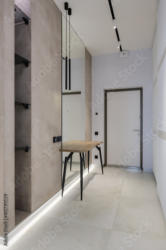 Modern luxury stylish apartment interior in pastel colors. a very bright room with huge windows filled with daylight. blue walls, wooden parquet floors