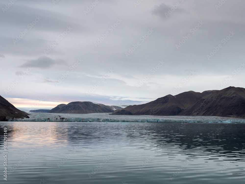 photos of mountains, glaciers, icebergs, and sea ice in the Canadian Arctic landscape. 
