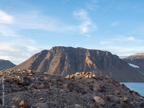 photos of mountains, glaciers, icebergs, and sea ice in the Canadian Arctic landscape. 