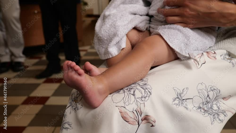 The sacrament of baptism. Newborn baby during christening. The sacrament of baptism. Newborn baby during christening.