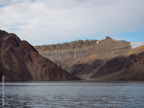 photo of mountain, glacier, sea ice, ocean and icebergs in the canadian arctic