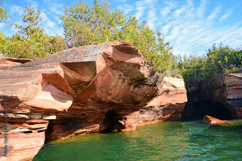 the colorful, eroded sea caves of devil's island on a sunny fall day in the apostles islands in lake superior off the bayfield peninsula in northern wisconsin