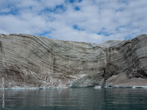 photo of mountain, glacier, sea ice, ocean and icebergs in the canadian arctic