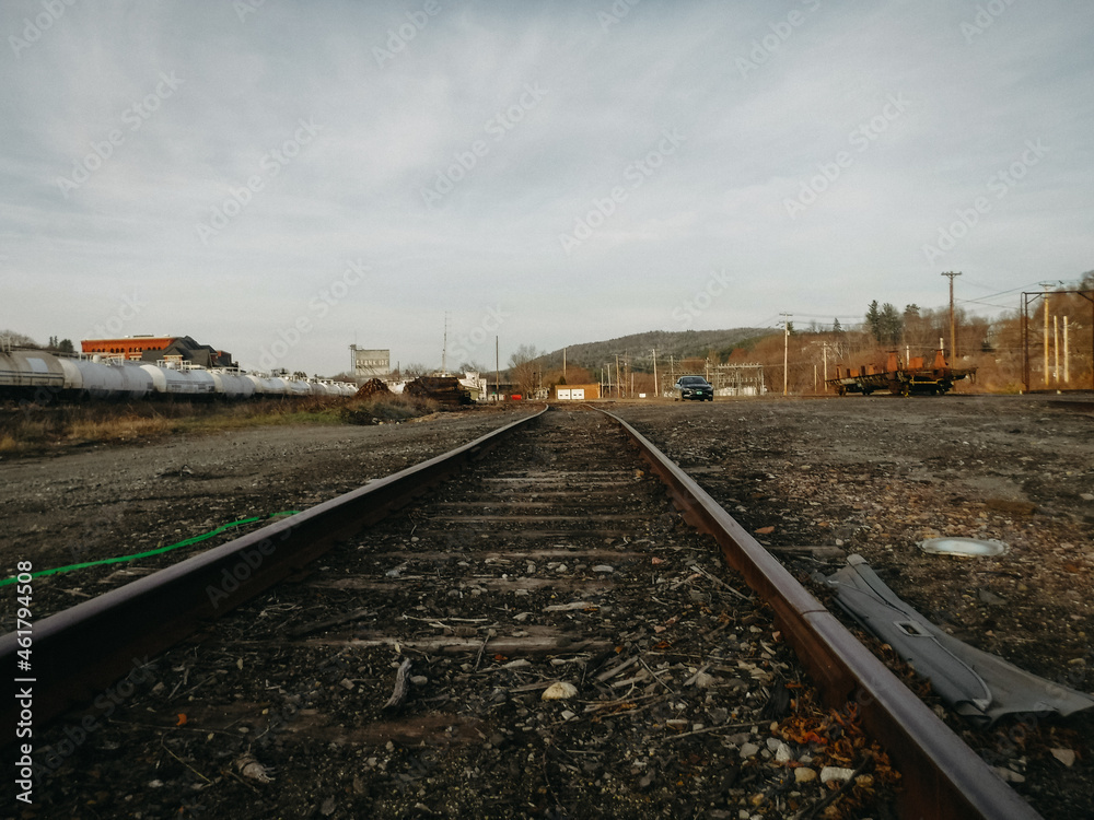 Railroad tracks in open gravel area Railroad tracks in open gravel area