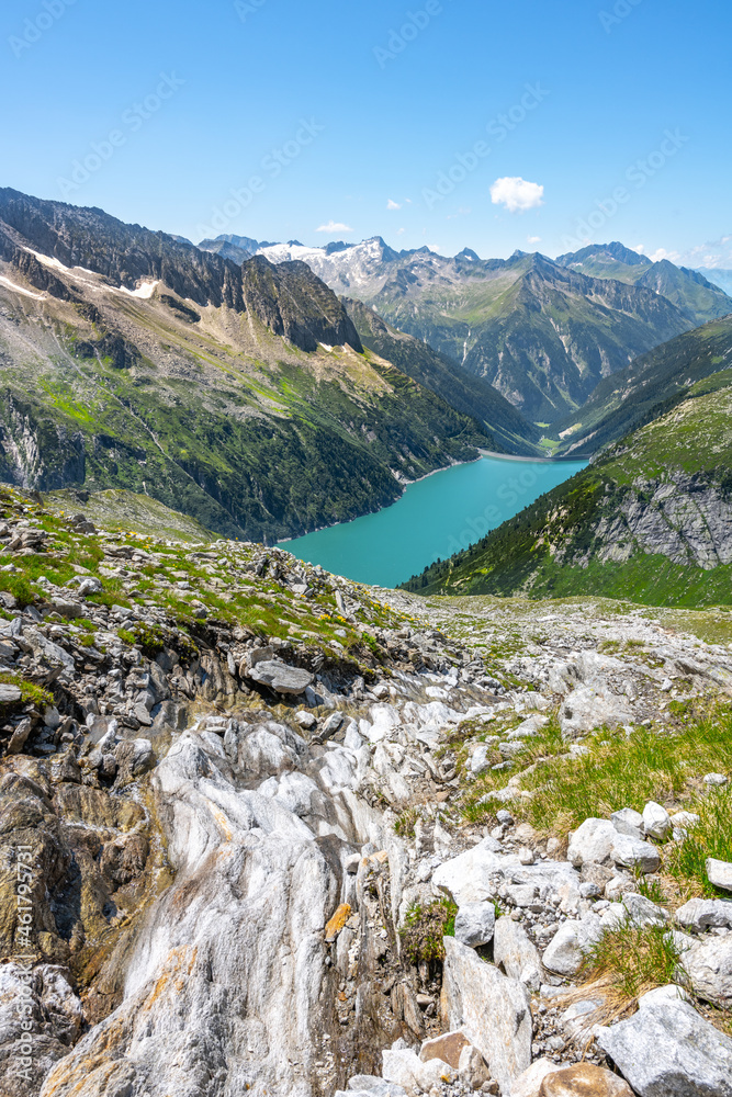 Beautiful alpine walley with azure blue water of Speicher Zillergrundl dam, Zillertal Alps, Austria