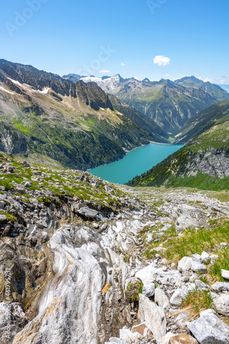 Beautiful alpine walley with azure blue water of Speicher Zillergrundl dam  Zillertal Alps  Austria