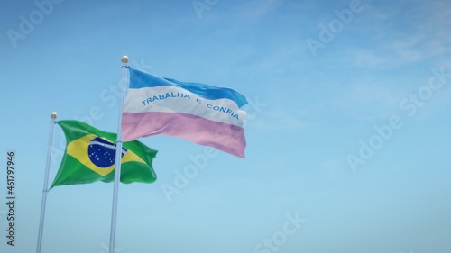 Waving flags of Brazil and the Brazilian state of Espírito Santo against blue sky backdrop. 3d rendering photo